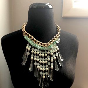 Gold necklace with light green pearls